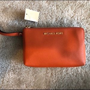Michael Kors Wristlet---Brown & Tangerine Colored
